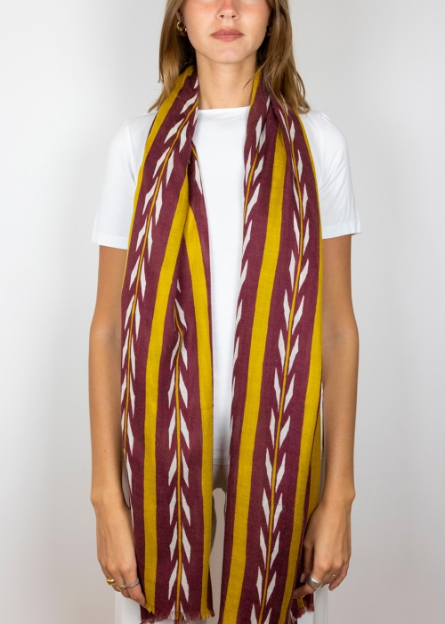 Model wearing Burgundy and mustard cashmere scarf made in italy