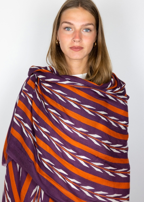 Model wearing a cashmere stole on the shoulders