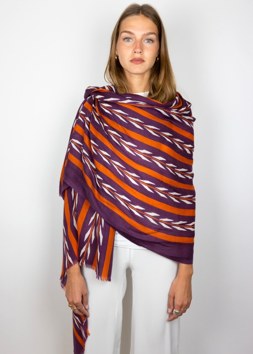 Model wearing a cashmere stole on the shoulders