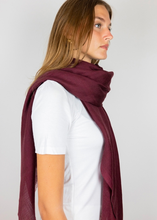 Model wearing burgundy maroon cashmere scarf made in Italy scarves