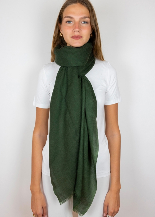 Model wearing cashmere scarf tied